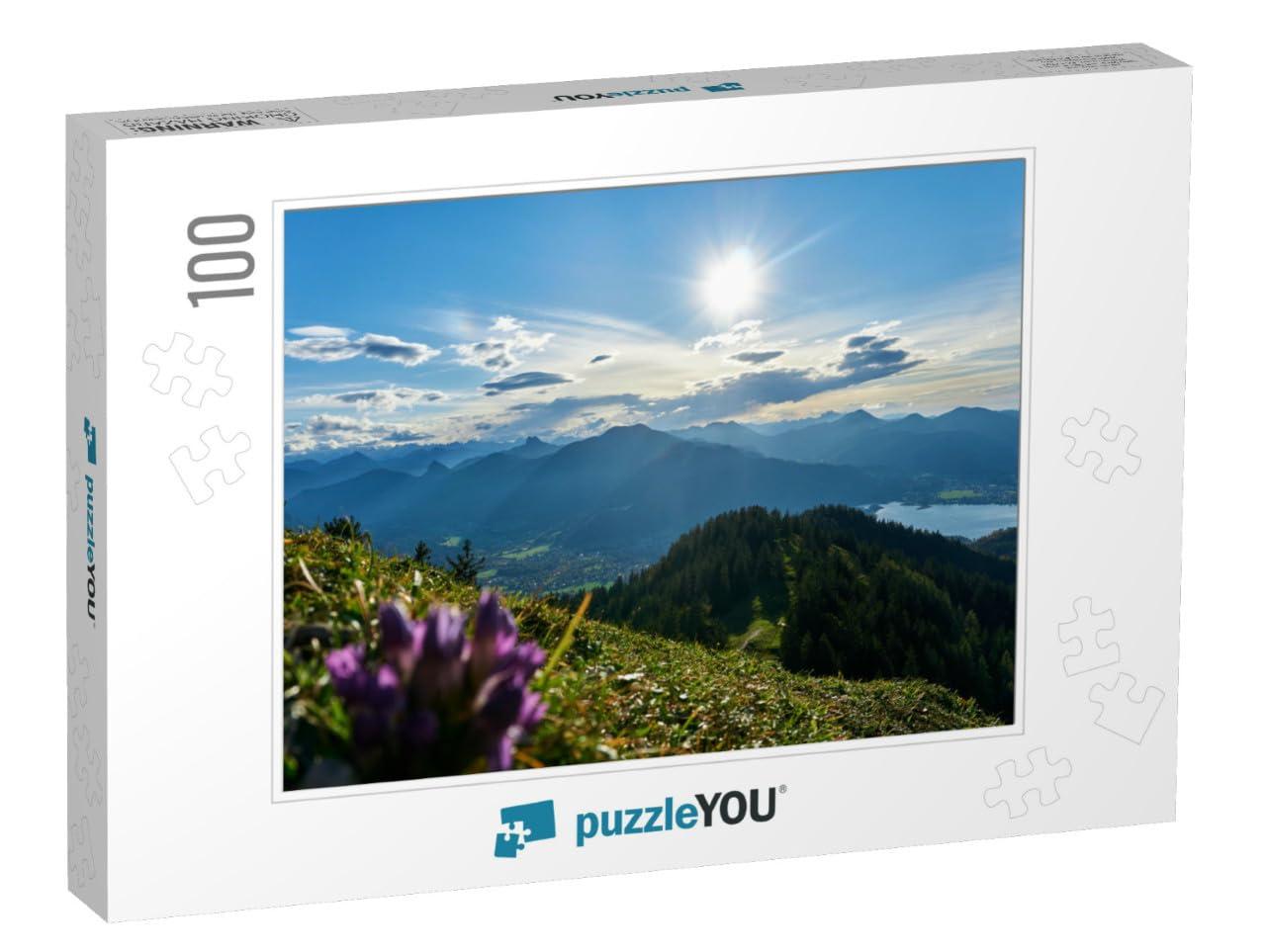 puzzleYOU Tegernsee in The Background of a Purple Flower Shot from... Jigsaw Puzzle Jigsaw Puzzle with 100 Pieces