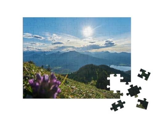 puzzleYOU Tegernsee in The Background of a Purple Flower Shot from... Jigsaw Puzzle Jigsaw Puzzle with 100 Pieces
