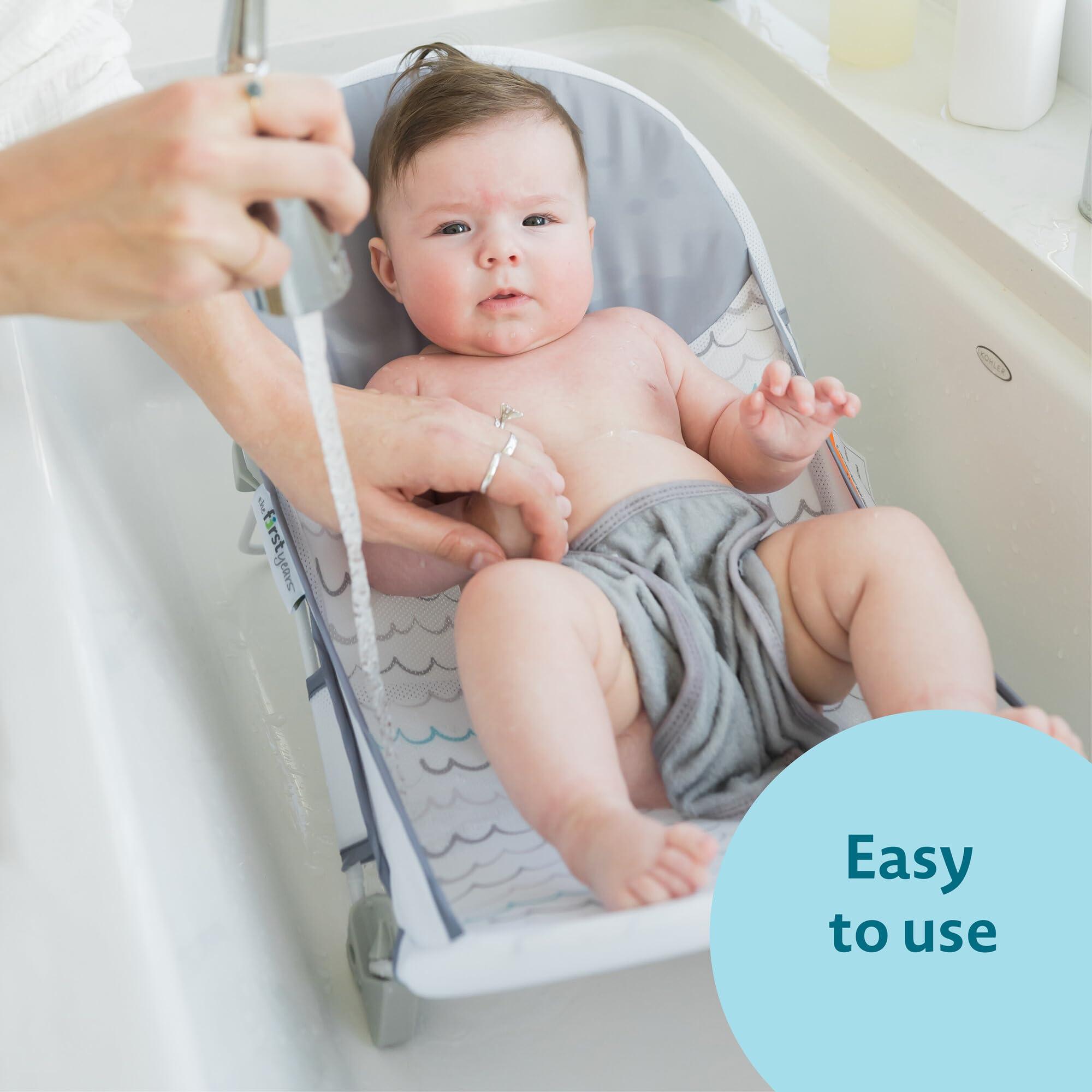 The First Years The First Years Sure Comfort Folding Baby Bather - Baby to Toddler Bath Tub - No-Slip Seat - for Sink or Tub Use